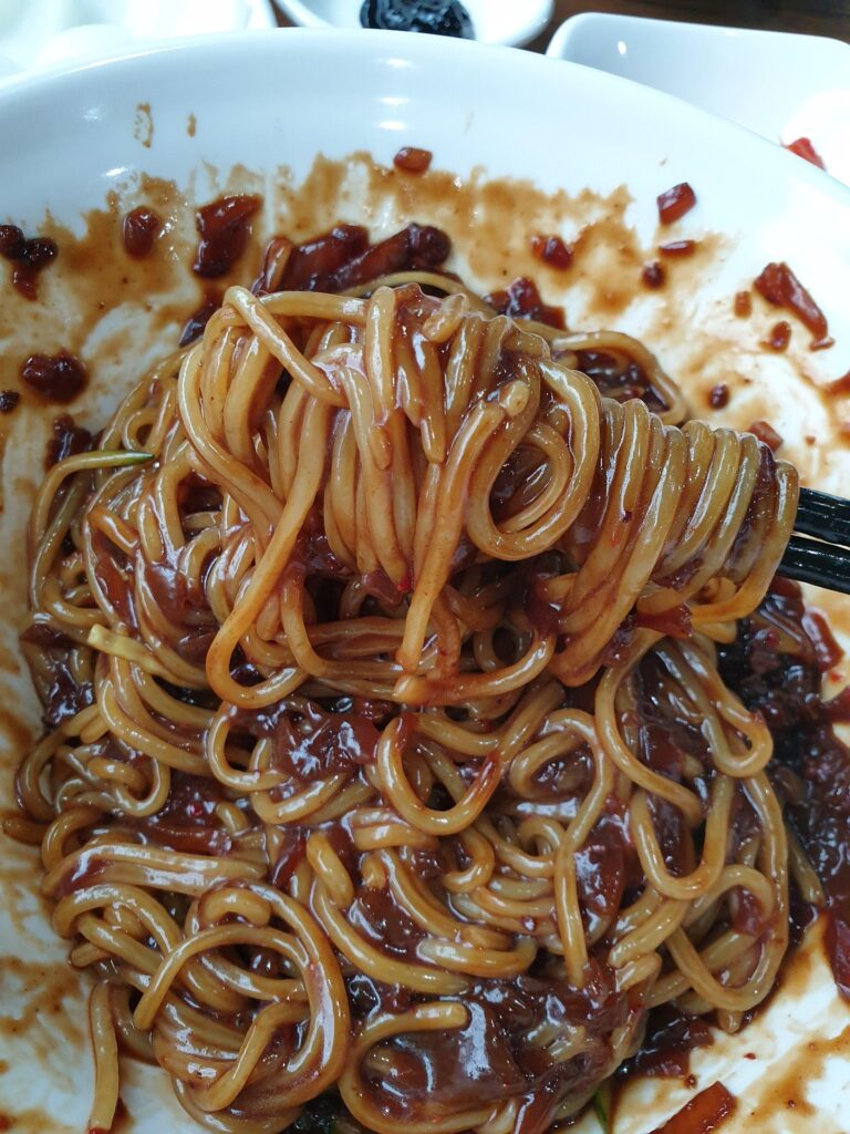 Traditional Korean Jajangmyeon with black bean sauce and noodles