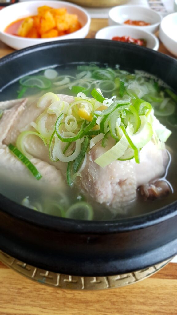Traditional Korean Samgyetang made with whole chicken, ginseng, and glutinous rice