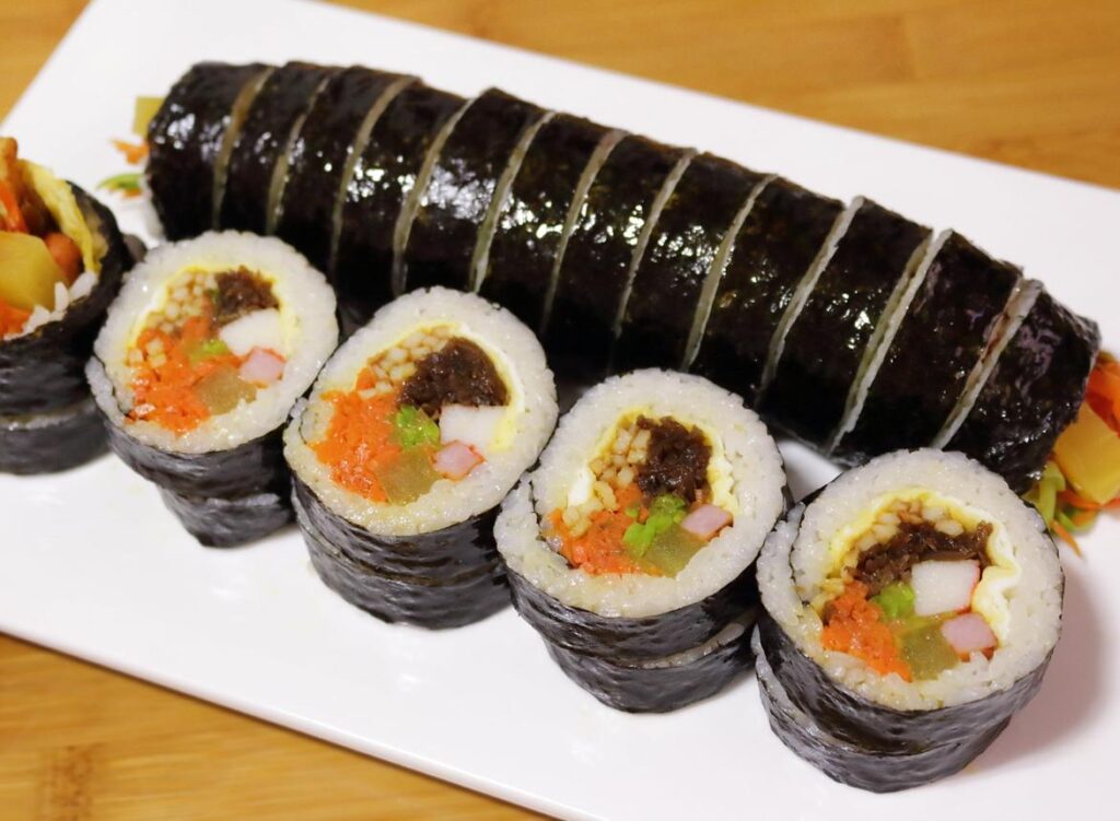 Traditional Korean Gimbap seaweed rice rolls with vegetables and fillings