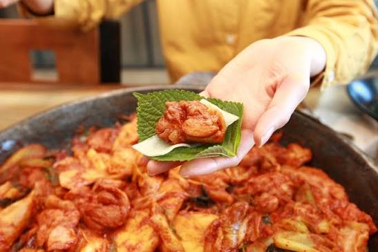 Traditional Korean Dakgalbi made with spicy stir-fried chicken and vegetables