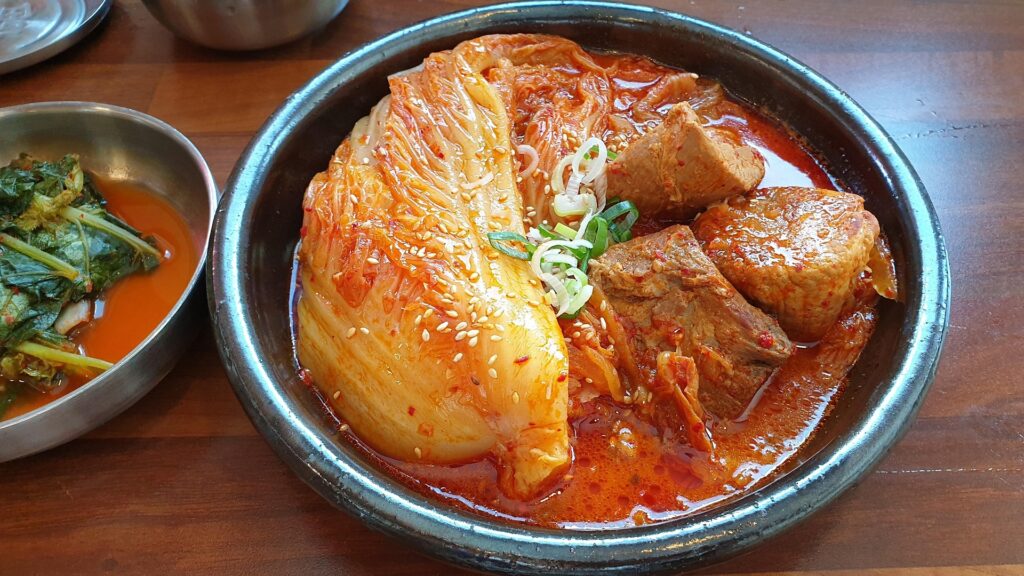 Traditional Korean Kimchi Jjigae made with fermented kimchi, tofu, and pork
