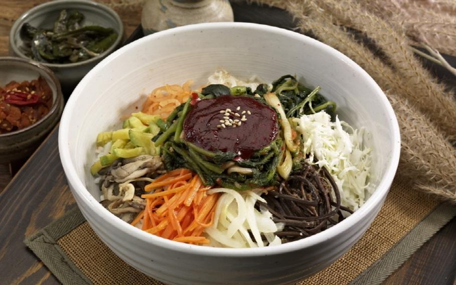 Bibimbap Korean rice bowl with vegetables and egg