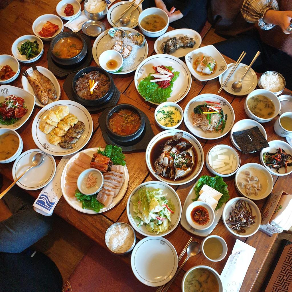 Traditional Korean meal with rice soup kimchi and side dishes